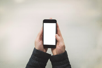 a pair of hands holding a smartphone