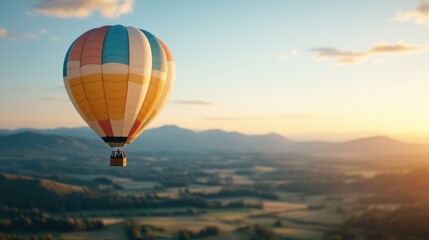 A hot air balloon with colorful stripes is seen soaring above the lush green fields during sunrise, offering a breathtaking aerial view of the sprawling countryside.