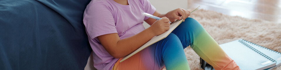 Fototapeta premium Header with girl drawing in her free time