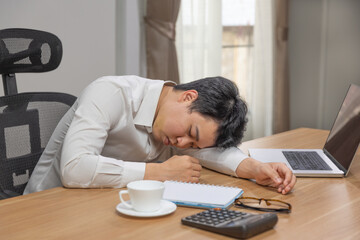 Man with narcolepsy is fall asleep on office desk..Narcolepsy is a sleep disorder that makes people...