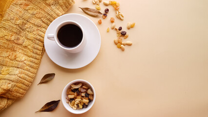 White cup with coffee and with autumn colors
