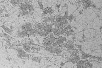 Map of the streets of Rotterdam (Netherlands) made with black lines on grey paper. Top view. 3d render, illustration