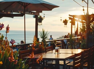 Outdoor Patio Restaurant with Sunset View and Ocean Background