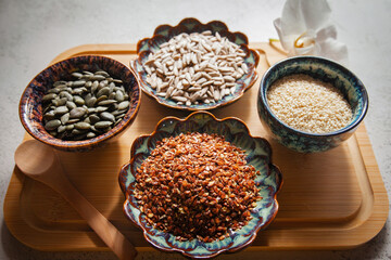 Seed cycling for hormonal balance - flax, pumpkin, sunflower and sesame seeds for different phases of menstrual cycle, women's health