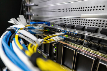 Network switch and ethernet cable in datacenter, Network connection technology and has a status LED to show working status, Fiber Optic Connection