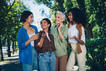 Portrait of group friends women chatting good mood pastime weekend walk city center park outdoors
