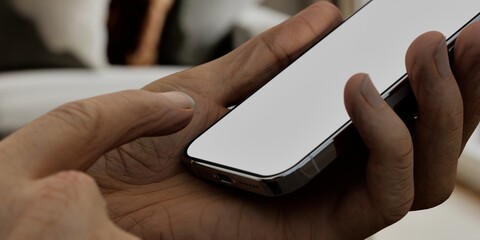 Caucasian White male using smartphone with a blank white screen. Living room, interior design, modern apps mockup. Vertical phone orientation