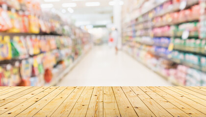 Empty wood table top with supermarket blurred background for product display