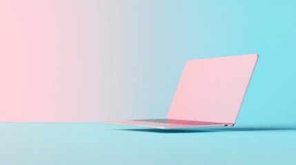 Pink laptop computer on blue background.
