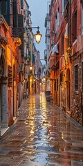 Fototapeta premium Narrow Street in Venice Italy with cobblestone street and buildings