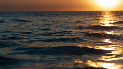 Blurred bokeh of a sunrise over a calm ocean