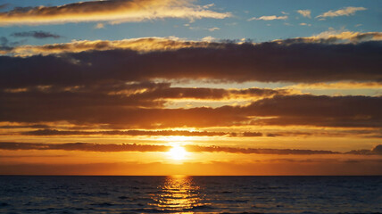 Blurred bokeh of a sunrise over a calm ocean