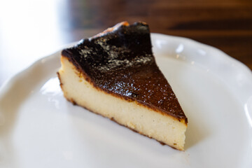 Simple Slice of Basque Cheesecake on a White Plate