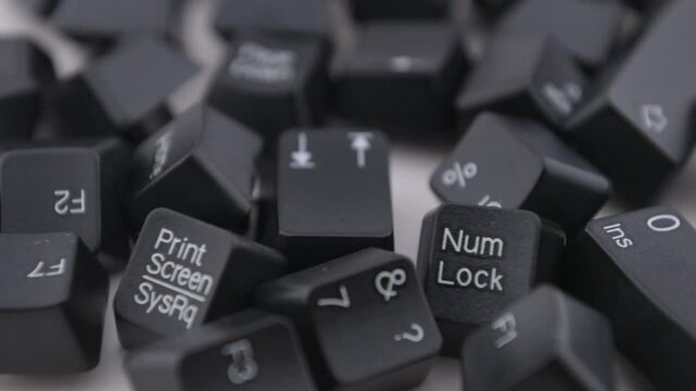 Black keyboard  keycaps rotates on white backgrond.