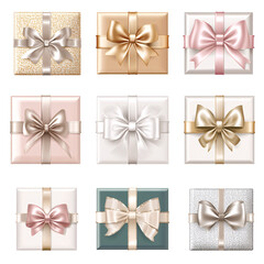 A collection of elegant gift boxes adorned with various ribbon styles and colors.