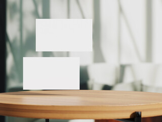 Clean minimal business card mockup on table with office background