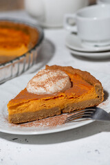 piece of pumpkin pie with cream, vertical closeup