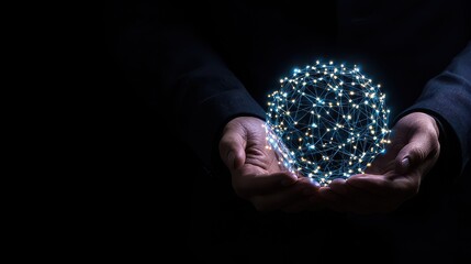 A person is holding a glowing sphere in their hand. The sphere is surrounded by a network of lines, giving it a futuristic and technological appearance