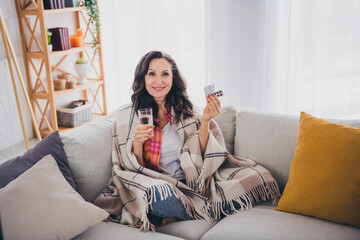 Photo of positive good mood woman dressed shirt tacking pills drinking water indoors house...