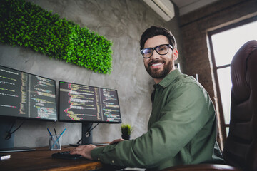 Photo of happy intelligent man cyber admin wear shirt work with modern technology server pc indoors