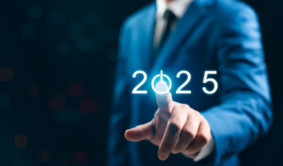 New Year 2025 Business start-up to goals, A businessman taps start-up button for New Year 2025, sets goals, for develops strategies to achieve better results success in the future.