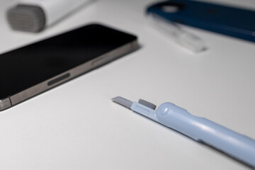 Close-up of the deep slot brush. Dust and dirt on the phone. Cleaning the phone