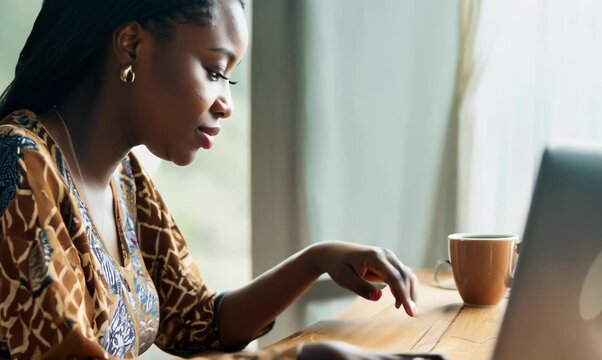 Zambian Woman Working on Laptop at Home