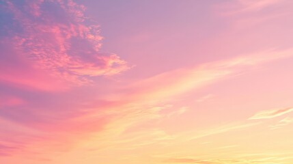 Colorful sunset sky with gentle orange and pink light reflecting off thin clouds
