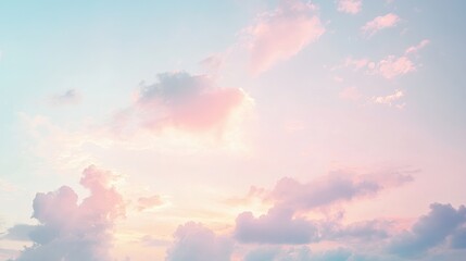 Serene morning sky with pastel tones of pink and blue as the sun rises