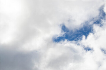 White passenger airplane flying in the sky amazing clouds in the background - Travel by air transport. High quality photo