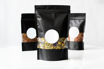 tea Black premium zip package mockup with the tea blend inside isolated on white background with...