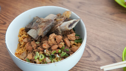 Short rib noodle in a white bowl