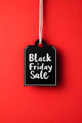 Price tag on a red background. Banner for Black Friday or seasonal sale. Sale template with copy space. Christmas sale. 