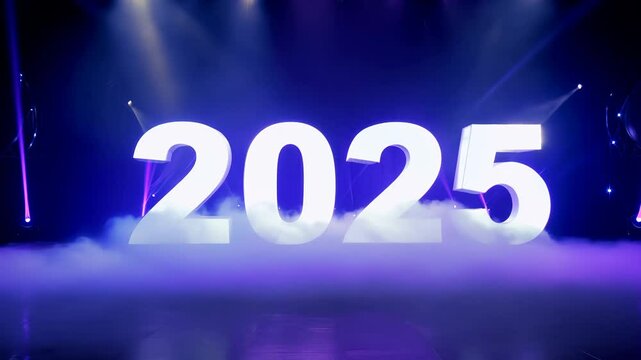 Glowing "2025" text on a purple light background with stage lighting