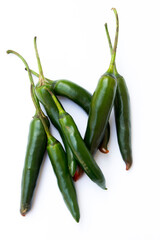 A picture of green chilies. Green chilies are high in vitamin C and beta-carotene, making them good for the skin. 