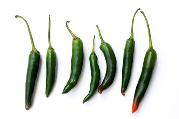 A picture of green chilies. Green chilies are high in vitamin C and beta-carotene, making them good for the skin. 