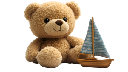 a teddy bear and a toy boat. 
