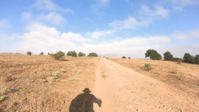 French Way of Saint James - a dirt road near Ages (Arlanzon), comarca of Montes de Oca, province of Burgos, Castile and Leon, Spain