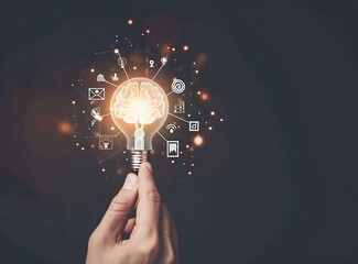 Glowing light bulb in hand on dark background. Idea and innovation concept