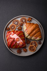 Crispy sweet red croissant with pistachio, raspberry and strawberry