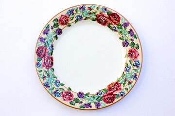 A collection of porcelain plates with classic roses images and motifs. This plate is large in size and can serve a large amount of food.