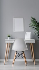blank photo frame mockup on grey wall with minimal white desk and plant decorating