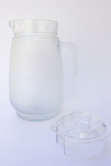A glass jug or glass pitcher isolated in the white background. This glass jug or pitcher is made from high-quality glass, which provides transparency, durability, and non-reactive properties.