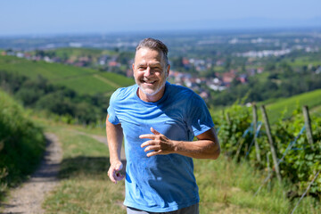 Fototapeta premium Running with a Smile Through the Vineyards