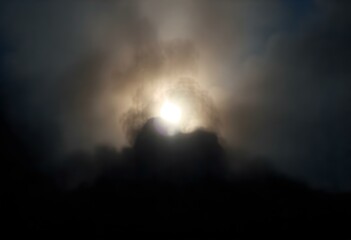 a vivid light flare bursting through a dark, smoky atmosphere, casting interesting shadows create with ai