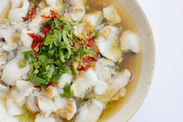A plate of white snapper soup or better known as barramundi fish. Barramundi is a good source of various vitamins and minerals, including vitamin D, selenium, phosphorus, and niacin (vitamin B3). Thes