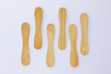 Ice cream sticks, also known as popsicle sticks, are typically made from wood and used for crafting, cooking, and as a handle for ice cream or popsicles.