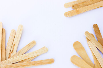 Ice cream sticks, also known as popsicle sticks, are typically made from wood and used for crafting, cooking, and as a handle for ice cream or popsicles.