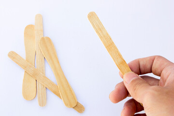 Ice cream sticks, also known as popsicle sticks, are typically made from wood and used for crafting, cooking, and as a handle for ice cream or popsicles.
