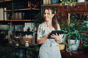 Woman, tablet and inventory check at flower store, small business and entrepreneur for online shop. Female person, reading customer review and app to monitor stock, thinking and site to sell product